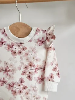 Body z falbankami przy rękawach kwitnący sad