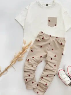 Legginsy dziecięce biedronki na beżu