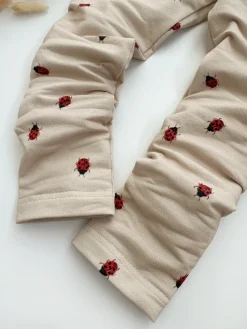 Legginsy dziecięce biedronki na beżu