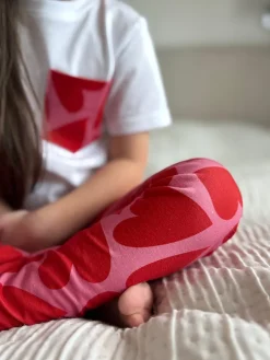 Legginsy dziecięce serca na różu