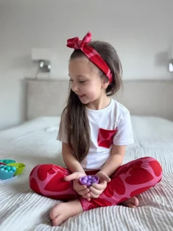 Legginsy dziecięce serca na różu