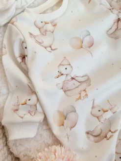 Pajac niemowlęcy bez stópek gąska z tortem