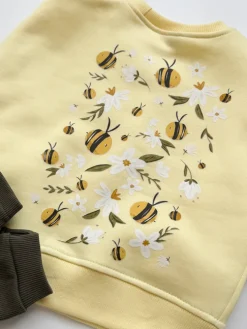 Żółta bluza dziecięca z nadrukiem pszczółek