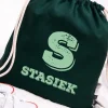 Zielony worek dla dziecka z inicjałem